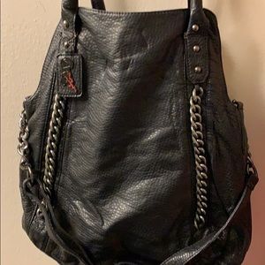 Black Satchel by Carlos Santana